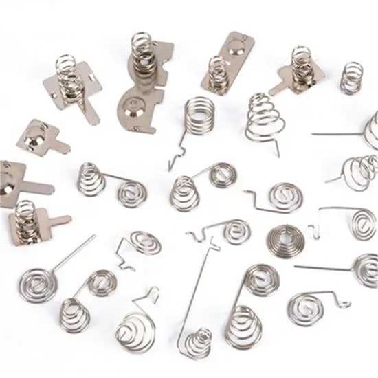 Custom spring type battery contact types for medical devices